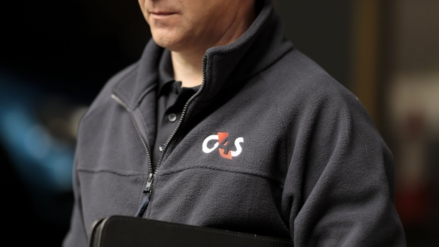 A G4S Plc logo sits on a fleece worn by a security guard at one of the company's offices in London, U.K., on Monday, Sept. 21, 2020. Harris Associates, one of the largest shareholders in G4S Plc, said it values the U.K. security group "significantly higher" than a roughly 2.9 billion-pound ($3.7 billion) takeover offer from Canadian peer GardaWorld. Photographer: Jason Alden/Bloomberg
