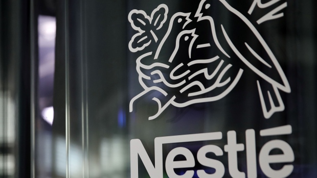 A bird's nest logo sits on display at the Nestle SA headquarters in Vevey, Switzerland, on Wednesday, Feb. 12, 2019. While Nestle’s 2019 sales growth accelerated, analysts doubt the world’s largest food company will achieve growth above 4% this year. Photographer: Stefan Wermuth/Bloomberg