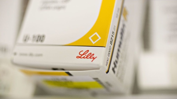An Eli Lilly & Co. logo is seen on a box of Humulin brand insulin medication in this arranged photograph at a pharmacy in Princeton, Illinois, U.S., on Monday, Oct. 23, 2017. Eli Lilly is scheduled to release earnings figures on October 24. Photographer: Bloomberg/Bloomberg