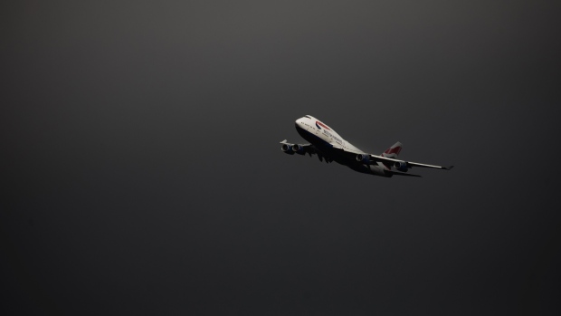A 747-400 jumbo jet, manufactured by Boeing Co., with the registration G-BYGA, operated by British Airways, a unit of International Consolidated Airlines Group SA, circles the airport prior to landing at Cotswold Airport in Cirencester, U.K., on Tuesday, Sept. 8, 2020. British Airways, the world's biggest operator of Boeing Co.747-400s, is retiring its entire fleet of the jumbo jets with immediate effect because of the damage the coronavirus has done to air travel. Photographer: Chris Ratcliffe/Bloomberg