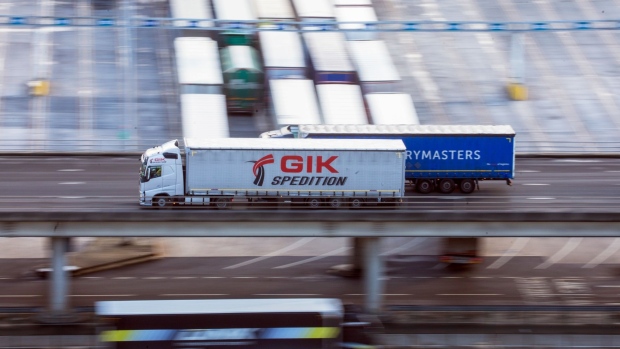 Haulage trucks drive at the Port of Dover Ltd. after disembarking a ferry in Dover, U.K., on Friday, Dec. 4, 2020. Negotiators are racing to save a trade deal between the U.K. and European Union in light of a major dispute just hours before they were expecting to announce an accord. Photographer: Chris Ratcliffe/Bloomberg