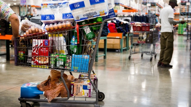 A customer stands by a shopping cart inside a Costco Wholesale Corp. store in Miami, Florida, U.S., on Monday, Dec. 5, 2016. Costco Wholesale Corp. is scheduled to release earnings figures on December 8. Photographer: Scott McIntyre/Bloomberg