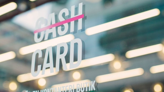 A sign on a window translates as "we are a cashless shop" on a store in Stockholm, Sweden, on Thursday, Aug. 6, 2020. Sweden was unable to escape its worst economic contraction ever despite adopting one of Europe’s softest approaches to the Covid-19 pandemic.