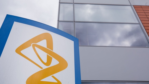 A sign featuring the AstraZeneca Plc logo stands near the company's DaVinci building at the Melbourn Science Park in Cambridge, U.K., on Monday, June 8, 2020.