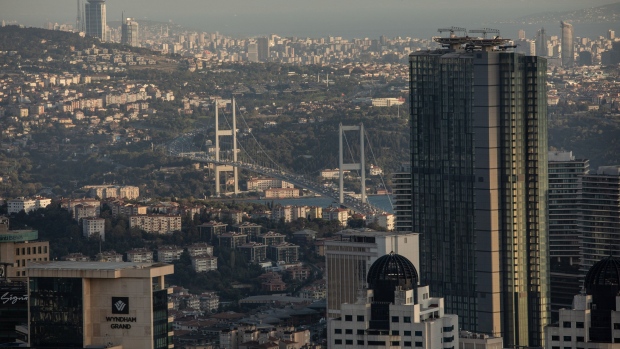 The July 15th Martyrs bridge stands beyond commercial skyscraper office buildings and residential buildings on the city skyline seen from the Istanbul Sapphire observation deck in Istanbul, Turkey, on Wednesday, Sept. 16, 2020. Turkish bank stocks, hardest hit by a selloff of Istanbul equities from foreigners, are trading at a record discount to local industrial sectors. Photographer: Nicole Tung/Bloomberg