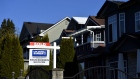 A "Sold" sign is displayed outside a home in Vancouver, British Columbia, Canada, on Thursday, April 16, 2020. As its oil sector shriveled in recent years, Canada's economy became ever more driven by real estate, an industry now in a state of paralysis while its households are among the world's most indebted, poorly placed to weather the storm. Photographer: Jennifer Gauthier/Bloomberg