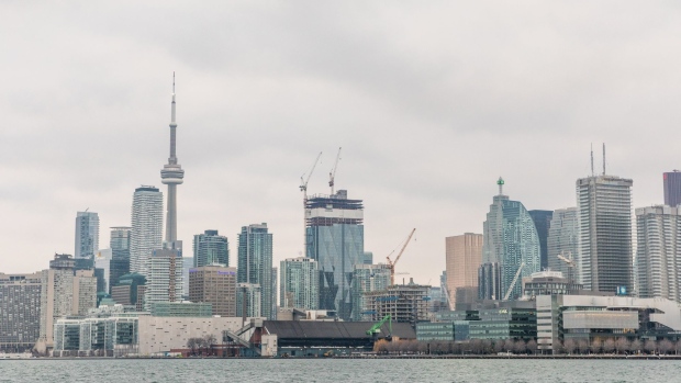 Buildings stand under construction along the skyline in Toronto, Ontario, Canada, on Sunday, Feb. 16, 2020. A shrinking supply of available homes for sale in Canada's largest city continued to drive prices higher last month, bringing annual increases to the strongest in more than two years. Photographer: Brett Gundlock/Bloomberg