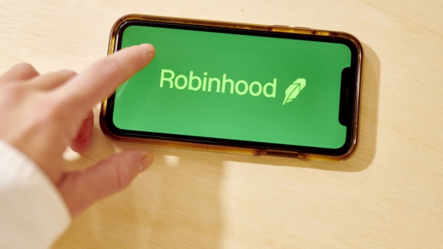 The logo for Robinhood is displayed on a smartphone in an arranged photograph taken in the Brooklyn borough of New York, U.S., on Monday, Oct. 12, 2020. Even though the firm said this year that it has more than doubled its customer-service team, clients complain they're struggling to get quick help when their funds are disappearing. Photographer: Gabby Jones/Bloomberg