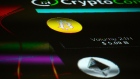 The symbols for Bitcoin and Ethereum cryptocurrency sit displayed on a screen during the Crypto Investor Show in London, U.K., on Saturday, March 10, 2018. Photographer: Mary Turner/Bloomberg