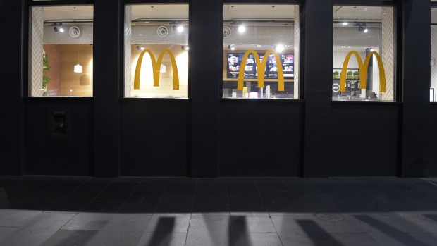 A McDonalds Corp. restaurant stands at night in Melbourne, Australia, on Thursday, July 30, 2020. There are mounting concerns that the stay-at-home order in Melbourne, begun three weeks ago, will need to be extended, inflicting further damage on the economy. Photographer: Carla Gottgens/Bloomberg