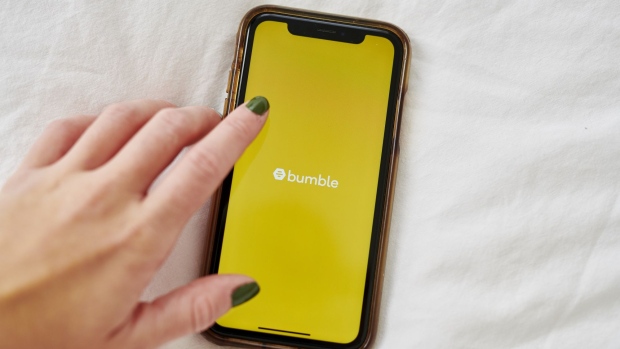 The logo for Bumble is displayed on a smartphone in an arranged photograph taken in the Brooklyn borough of New York, U.S., on Friday, Oct. 9, 2020. Blackstone Group, which bought a majority stake in the owner of dating app Bumble last year when it was known as MagicLab, is now seeking a payout from a $200 million loan. Photographer: Gabby Jones/Bloomberg