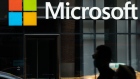 A pedestrian walks past a Microsoft Technology Center in New York, U.S., on Wednesday, July 22, 2020. Microsoft Corp. is set to post quarterly results after the closing bell and the tech bellwether's performance will likely uphold its standing as a darling of Wall Street. Photographer: Jeenah Moon/Bloomberg