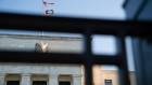 The Marriner S. Eccles Federal Reserve building stands behind a fence in Washington, D.C., U.S., on Tuesday, Aug. 18, 2020. In addition to helping rescue the U.S. economy amid the coronavirus pandemic, Fed Chair Jerome Powell and colleagues also spent 2020 finishing up the central bank’s first-ever review of how it pursues the goals of maximum employment and price stability set for it by Congress. Photographer: Erin Scott/Bloomberg