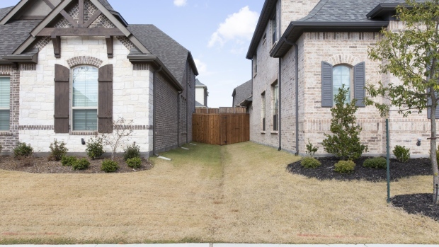 New homes stand at the Lexington Country development in Frisco, Texas, U.S., on Saturday, Nov. 17, 2018. Hot markets are cooling fast as interest rates rise. In the great housing slowdown of 2018, shoppers are reclaiming the upper hand, after years of soaring prices that placed most inventory out of reach for many families. Photographer: Laura Buckman/Bloomberg