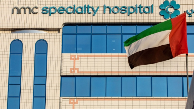 The national flag of the United Arab Emirates flies outside the NMC Speciality Hospital, operated by NMC Health Plc, in Dubai, United Arab Emirates, on Sunday, March 1, 2020. Troubled NMC Health Plc, the largest private health-care provider in the United Arab Emirates, asked lenders for an informal standstill on its debt as Dubai weighs an injection of capital to safeguard the emirate’s reputation among global investors.