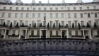 Luxury residential properties stand in Grosvenor Crescent in London, U.K., on Friday, Dec. 30, 2016. Luxury home prices in some of London's most expensive districts are down more than 10 percent this year, and land values are also dropping.