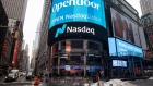 A monitor displays Opendoor Technologies Inc. signage in front of the Nasdaq MarketSite during the company's initial public offering (IPO) in New York, U.S., on Monday, Dec. 21, 2020. Tesla Inc.'s was among the biggest drags on the S&P 500 in its first day of trading on the benchmark.