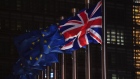 A U.K. national flag flies beside European Union (EU) flags outside the Berlaymont building in Brussels, Belgium, on Wednesday, Dec. 9, 2020.