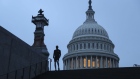 A runner stands near the U.S. Capitol in Washington.