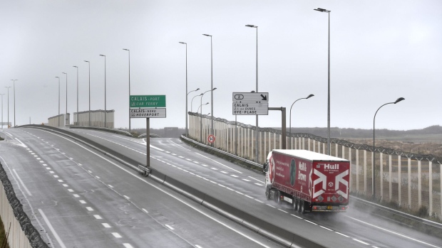 A lone freight truck on an empty highway leading to the Port of Calais, after France suspended traffic from the U.K., in Calais, France, on Monday, Dec. 21, 2020. Fearing a fast-spreading new strain of the virus that forced a strict lockdown across England, France on Sunday suspended travel from the U.K. for 48 hours and Germany halted arriving flights from Britain. Photographer: Geert Vanden Wijngaert/Bloomberg