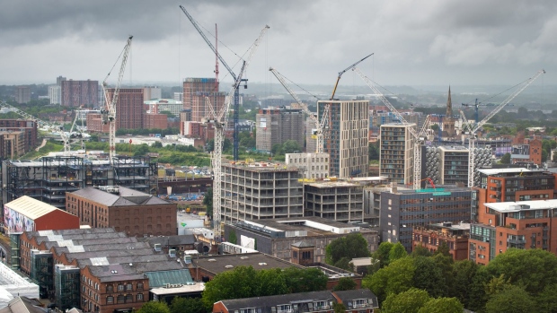 Cranes stand on construction sites in the skyline of central Manchester, U.K., on Tuesday, July 7, 2020. U.K. Chancellor of the Exchequer Rishi Sunak is likely to continue a policy of boosting demand for housing rather than increasing supply when he presents his economic recovery plan on Wednesday. Photographer: Anthony Devlin/Bloomberg
