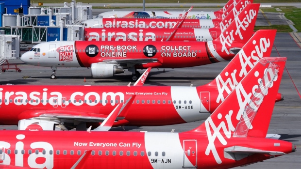 AirAsia Group Bhd. aircraft stand on the tarmac at Kuala Lumpur International Airport 2 (KLIA 2) in Sepang, Selangor, Malaysia, on Monday, Aug. 24, 2020. AirAsia is scheduled to report its quarterly results on Aug. 28. Photographer: Samsul Said/Bloomberg