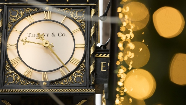 A branded clock hangs in front of a Tiffany & Co. luxury jewelry store in London, U.K. on Monday, Nov. 25, 2019. LVMH Moet Hennessy Louis Vuitton SE agreed to pay $135 a share for the U.S. jeweler, a 37% premium above the price before Bloomberg reported an initial approach in late October. Photographer: Jason Alden/Bloomberg