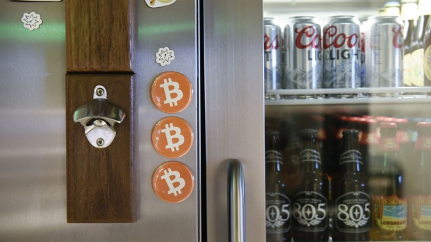 Bitcoin magnets are seen on a refrigerator in the kitchen at the Coinbase Inc. office in San Francisco, California, U.S., on Friday, Dec. 1, 2017. Coinbase wants to use digital money to reinvent finance. In the company's version of the future, loans, venture capital, money transfers, accounts receivable and stock trading can all be done with electronic currency, using Coinbase instead of banks. Photographer: Michael Short/Bloomberg