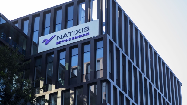 The Natixis SA logo sits on a sign outside the company's headquarters in Paris, France, on Saturday, June 29, 2019. The latest turmoil in European finance is swirling around H2O Asset Management, a London-based firm that boomed since its founding almost a decade ago with the backing of French investment bank Natixis.