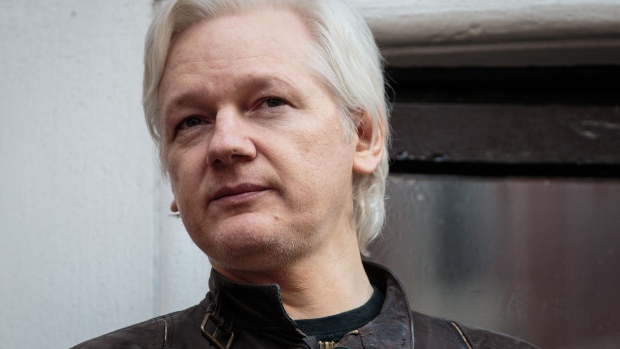 LONDON, ENGLAND - MAY 19: Julian Assange speaks to the media from the balcony of the Embassy Of Ecuador on May 19, 2017 in London, England. Julian Assange, founder of the Wikileaks website that published US Government secrets, has been wanted in Sweden on charges of rape since 2012. He sought asylum in the Ecuadorian Embassy in London and today police have said he will still face arrest if he leaves. (Photo by Jack Taylor/Getty Images)