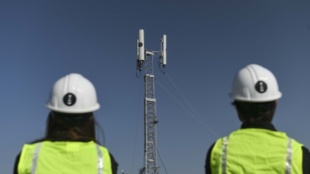 Technicians deploy a portable Dish Network Corp. 5G wireless tower at Daniels Park in Sedalia, Colorado, U.S., on Monday, Aug. 31, 2020. 