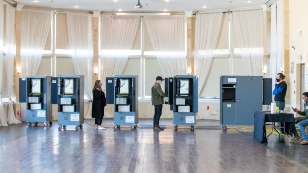 Voters casts their ballot at a polling location in Atlanta, Georgia, U.S., on Tuesday, Jan. 5, 2021.