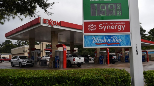 Vehicles refuel at an Exxon Mobil Corp. gas station in Houston, Texas, U.S., on Wednesday, Oct. 28, 2020. Exxon is scheduled to release earnings figures on October 30.