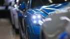 The head light of a Porsche 718 Cayman luxury automobile illuminates on the production line inside the Porsche AG factory in Stuttgart, Germany, on Thursday, March 5, 2020. Sports-car maker Porsche AG intends to offer more green debt to support its 6 billion-euro ($6.6 billion) investment in electric vehicles.
