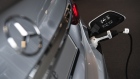 An electric charging plug refuels a Mercedes-Benz E-Class electric automobile. Photographer: Andreas Gebert/Bloomberg