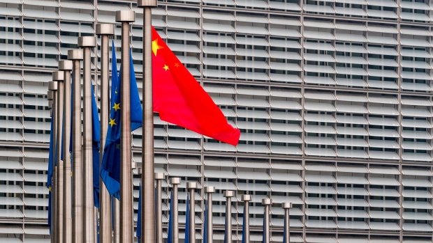 China’s national flag, flies in front of European Union (EU) flags outside the Berlaymont building during the EU-China summit in Brussels, Belgium, on Tuesday, April 9, 2019. The EU and China managed to agree on a joint statement for Tuesday’s summit in Brussels, papering over divisions on trade in a bid to present a common front to U.S. President Donald Trump, EU officials said.