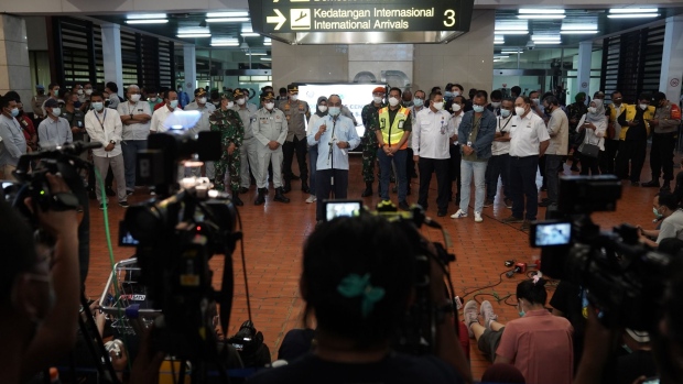 Officials speak to members of the media at the flight SJ 182 Crisis Center at Soekarno-Hatta International Airport in Cengkareng, near Jakarta, Indonesia, on Saturday, Jan. 9, 2021. Sriwijaya Air flight SJ182, a 26-year-old Boeing Co. 737-500 with 62 people aboard, went missing after losing contact with Indonesia’s aviation authorities shortly after takeoff from Jakarta.