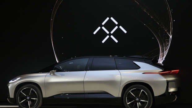 The Faraday Future FF91 electric car is unveiled at the 2017 Consumer Electronics Show (CES) in Las Vegas, Nevada, U.S., on Tuesday, Jan. 3, 2017. Faraday Future staked its claim to the world's fastest electric car with its FF91 production model, showing footage of it outracing Tesla Motors Inc.'s Model S in a glitzy event in Las Vegas. Photographer: Patrick T. Fallon/Bloomberg