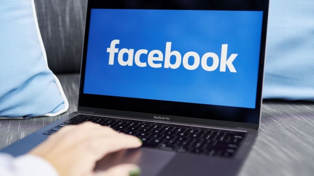 The logo for Facebook is displayed on a laptop computer in an arranged photograph taken in Little Falls, New Jersey, U.S., on Wednesday, Oct. 7, 2020. Facebook Inc. is tightening its rules on content concerning the U.S. presidential election next month, including instituting a temporary ban on political ads when voting ends, as it braces for a contentious night that may not end with a definitive winner. Photographer: Gabby Jones/Bloomberg
