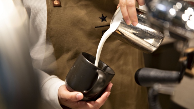 A barista pours milk into a cup while preparing a cappuccino during a preview of the new Starbucks Reserve Roastery in Chicago, Illinois, U.S., on Tuesday, Nov. 12, 2019. The Chicago roastery, which opens Nov. 15, will be the biggest yet for Starbucks, which has also opened locations in Seattle, Shanghai, Milan, New York and Tokyo. Photographer: Daniel Acker/Bloomberg