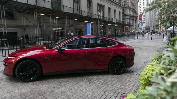 The Xpeng P7 electric vehicle is displayed outside the New York Stock Exchange in New York, U.S., on Thursday, Aug. 27, 2020. Chinese electric-car startup Xpeng Inc. is set to raise $1.28 billion after guiding its U.S. initial public offering above a marketed range, people familiar with the matter said, showing strong investor interest in the sector is not abating.