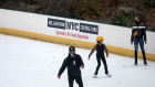 People wearing mask ice skate at Wollman Rink in Central Park in New York. 