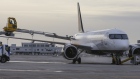 An Air Canada plane is de-iced in Montreal on Dec. 16, 2020.