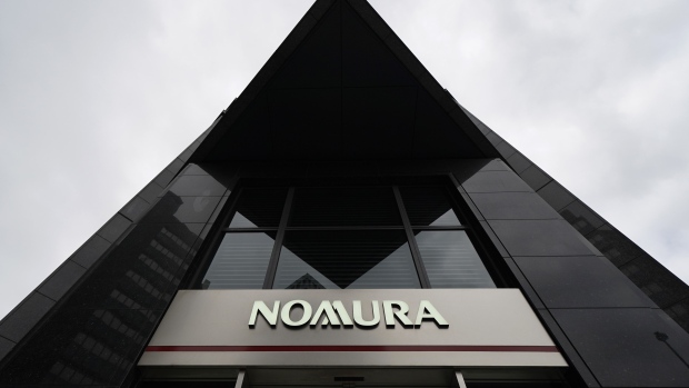 A sign for The Nomura Holdings Inc. is displayed outside a Nomura Securities Co. branch in Tokyo, Japan, on Tuesday, April 23, 2019. Nomura is scheduled to release its full-year earnings on April 25. Photographer: Toru Hanai/Bloomberg