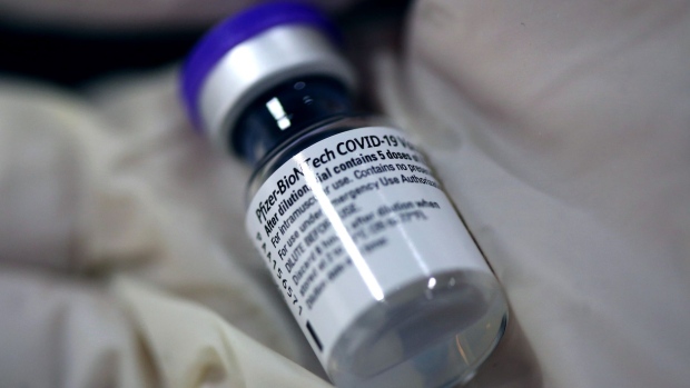 A vial of the Pfizer-BioNTech Covid-19 vaccine at the Mother and Child Hospital in Belgrade, Serbia, on Sunday, Jan. 10, 2021. Russian Direct Investment Fund (RDIF) signed an agreement with Serbian government to supply 2 million doses of Sputnik V Covid-19 vaccine, RDIF says in statement. Photographer: Oliver Bunic/Bloomberg