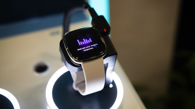 A Fitbit Inc. wearable device sits on display at the IFA Consumer Electronics Show at the Berlin Messe exhibition hall in Berlin, Germany, on Friday, Sept. 4, 2020. The electronics sector has found a way to thrive amid the global pandemic, with 5G demand helping the industry remain a rare catalyst for Asian factories.
