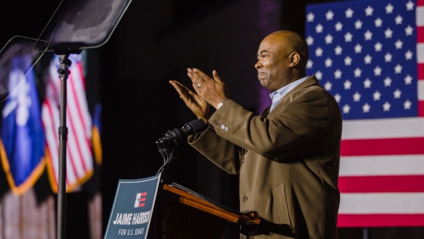 Jaime Harrison, a Democratic U.S. Senate candidate, gestures towards attendees during an election night party in Columbia, South Carolina, U.S., on Tuesday, Nov. 3, 2020. Senator Lindsey Graham's bet on President Donald Trump paid off, as he won a hard-fought and costly campaign against Democrat Jaime Harrison.