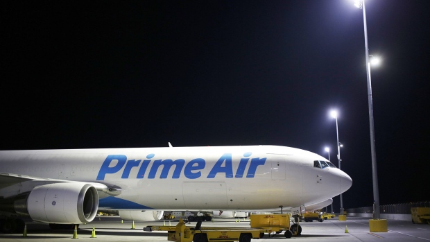 An Amazon.com Inc. Prime Air cargo jet sits parked at the DHL Worldwide Express hub of Cincinnati/Northern Kentucky International Airport in Hebron, Kentucky.