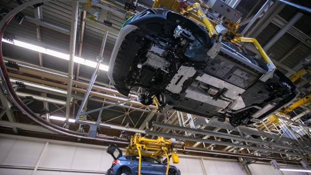 Cradles transport Ford Focus automobile bodies inside the Ford factory in Saarlouis, Germany, in 2019.