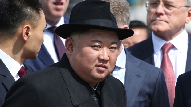 Kim Jong Un, North Korea's leader, watches an honor guard before his departure to North Korea at the railway station in Vladivostok, Russia, on Friday, April 26, 2019. Kim said the summit will be a “starting point for productive talks on cooperation,” Vesti TV reported him as saying in an interview. Photographer: Andrey Rudakov/Bloomberg